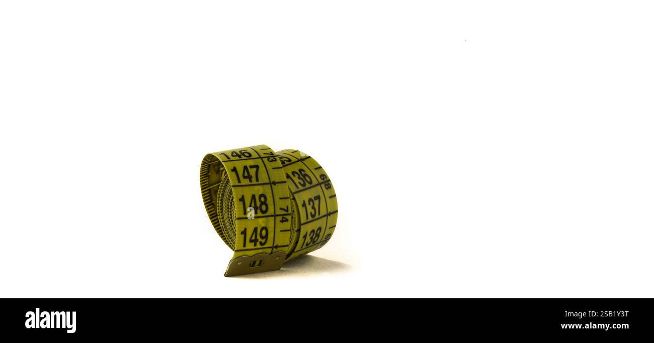 Rolled tailor's meter, measuring tape on a white background. Stock Photo