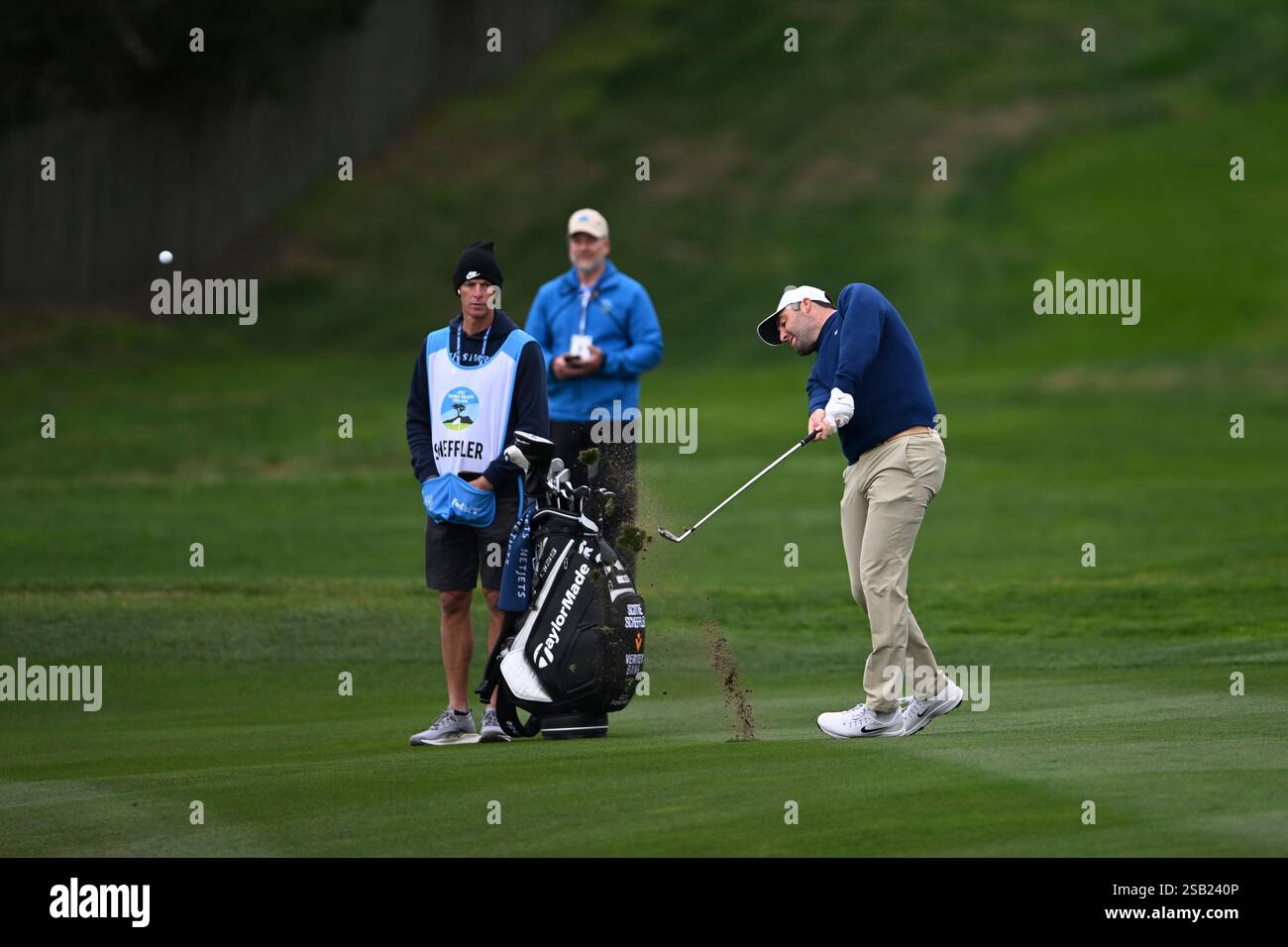 Scottie Scheffler hits from the fourth fairway at Pebble Beach Golf