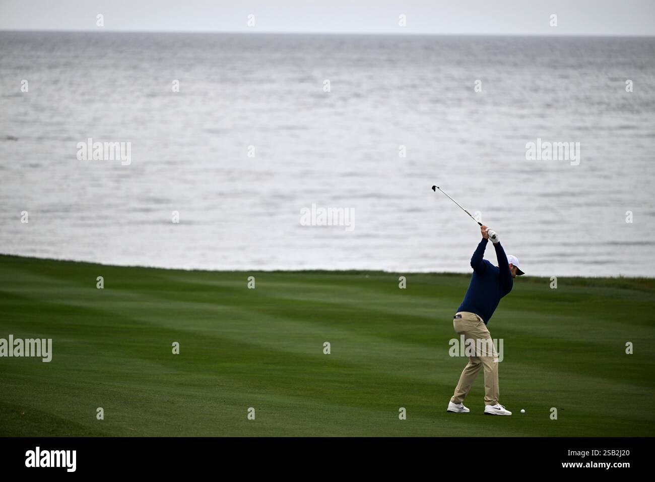 Scottie Scheffler hits from the sixth fairway at Pebble Beach Golf