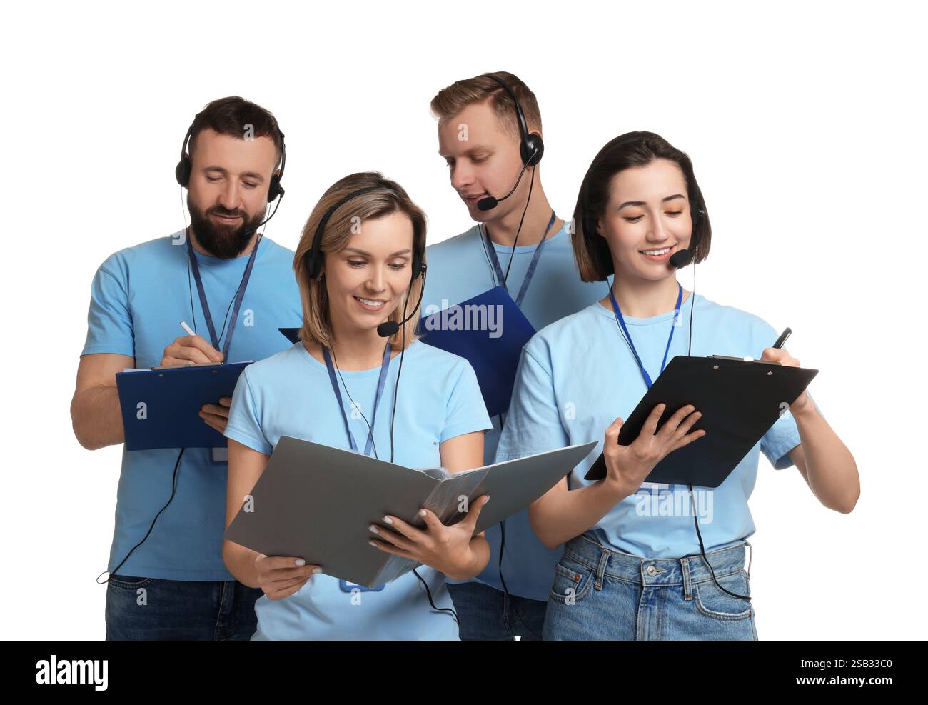 Technical support call center. Team of friendly operators working on ...