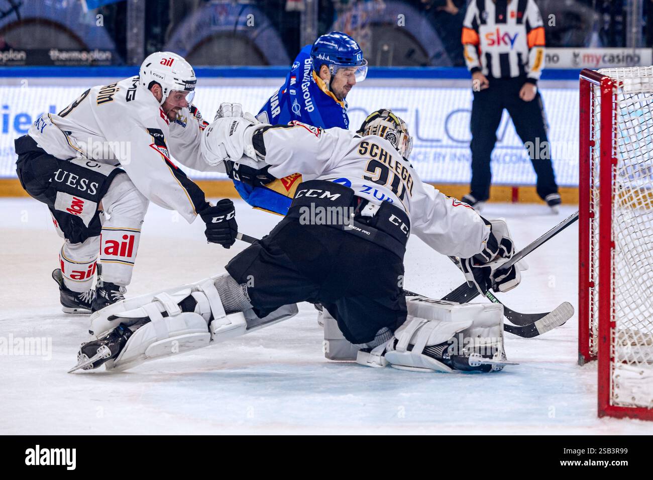 Goalkeeper Niklas Schlegel #34 (HC Lugano) and Carl Dahlstrom #63 (HC ...