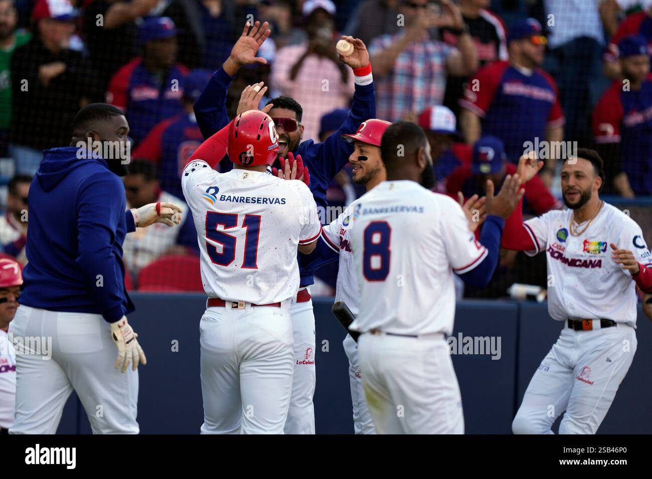 Dominican Republic's Jose Marmolejos (51) celebrates with teammates