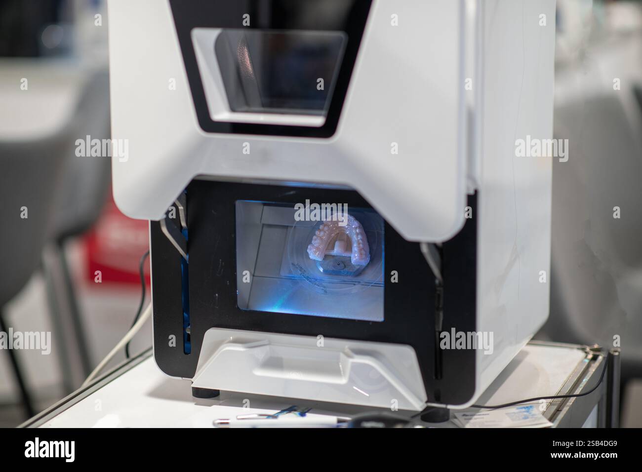 Dental milling machine. Equipment for crafting precise dental prosthetics, crowns, and implants with high efficiency. Stock Photo