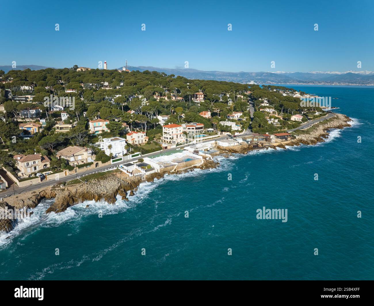 AERIAL VIEW. Peninsula of Antibes with beautiful villas. French Riviera, Alpes-Maritimes, Provence-Alpes-Côte d’Azur, France. Stock Photo