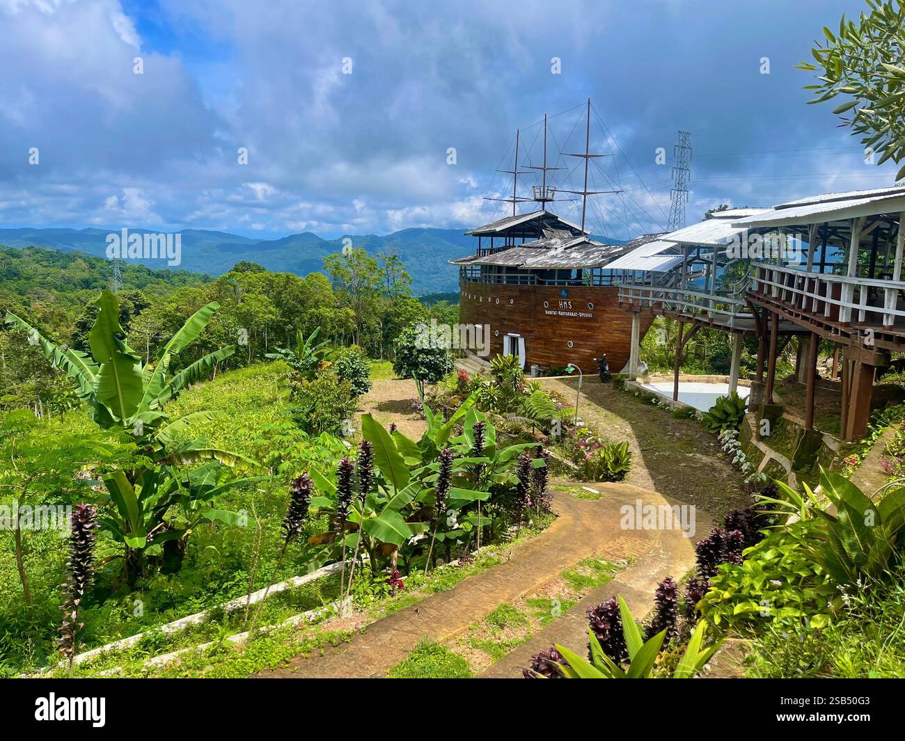 While scootering through the mainland of Flores, Indonesia; I came across this interesting cafe of an abandon boat. - Smartphone Captured Stock Image