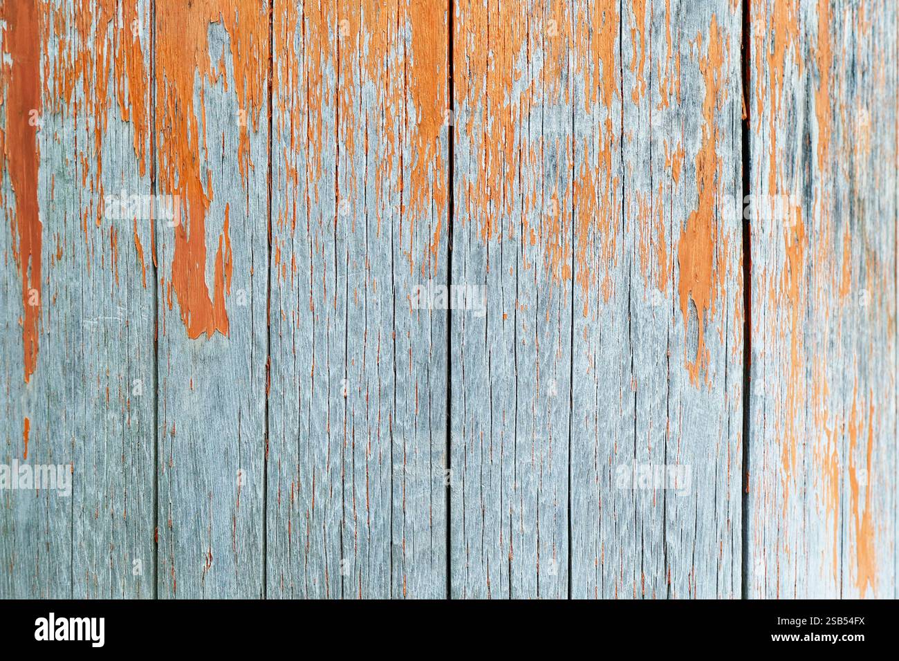 wooden panel with old orange paint Stock Photo