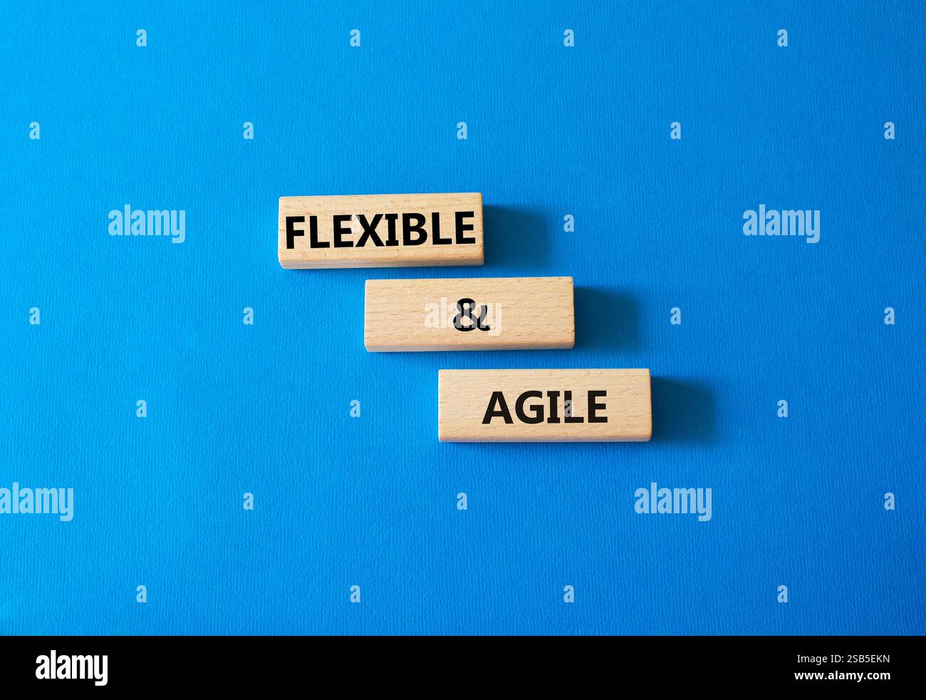Flexible and agile symbol. Concept word Flexible and agile on wooden ...
