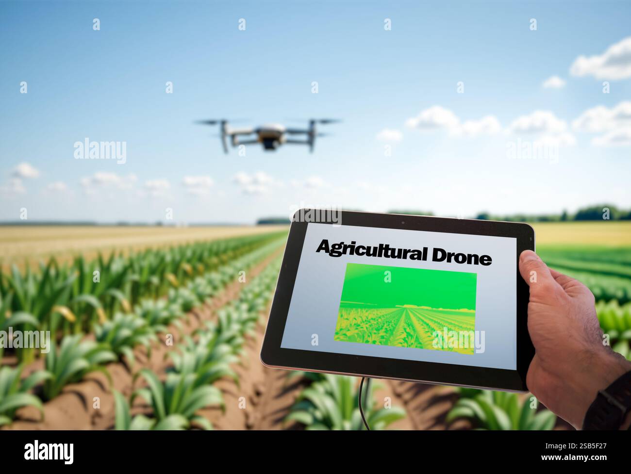 Farmer using drone and tablet for precision agriculture in crop field Stock Photo
