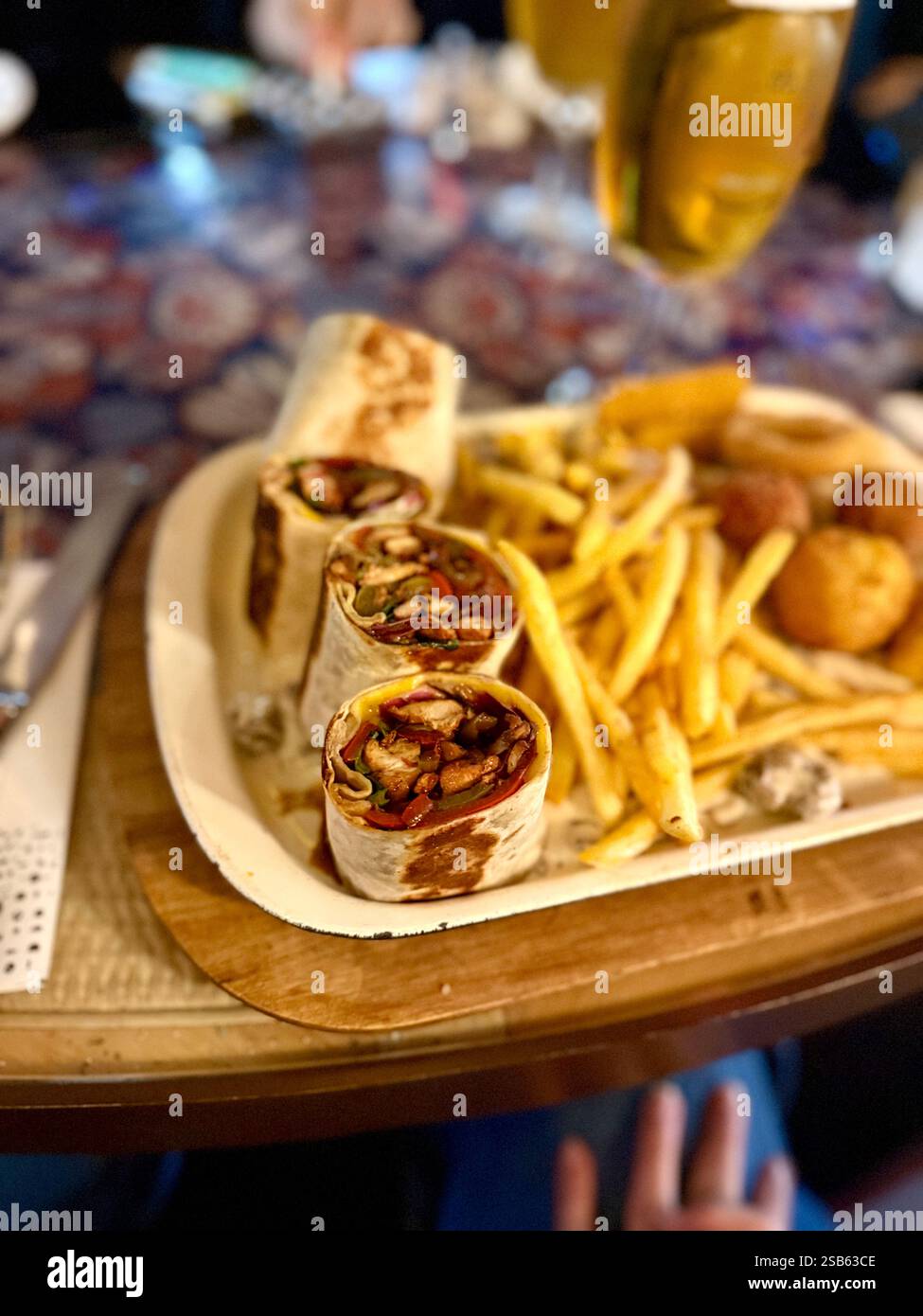 Large beer plate, large set of beer snacks. assorted snacks deep-fried beer. Food for a holiday for a large company. hot meat snacks for beer served o Stock Photo