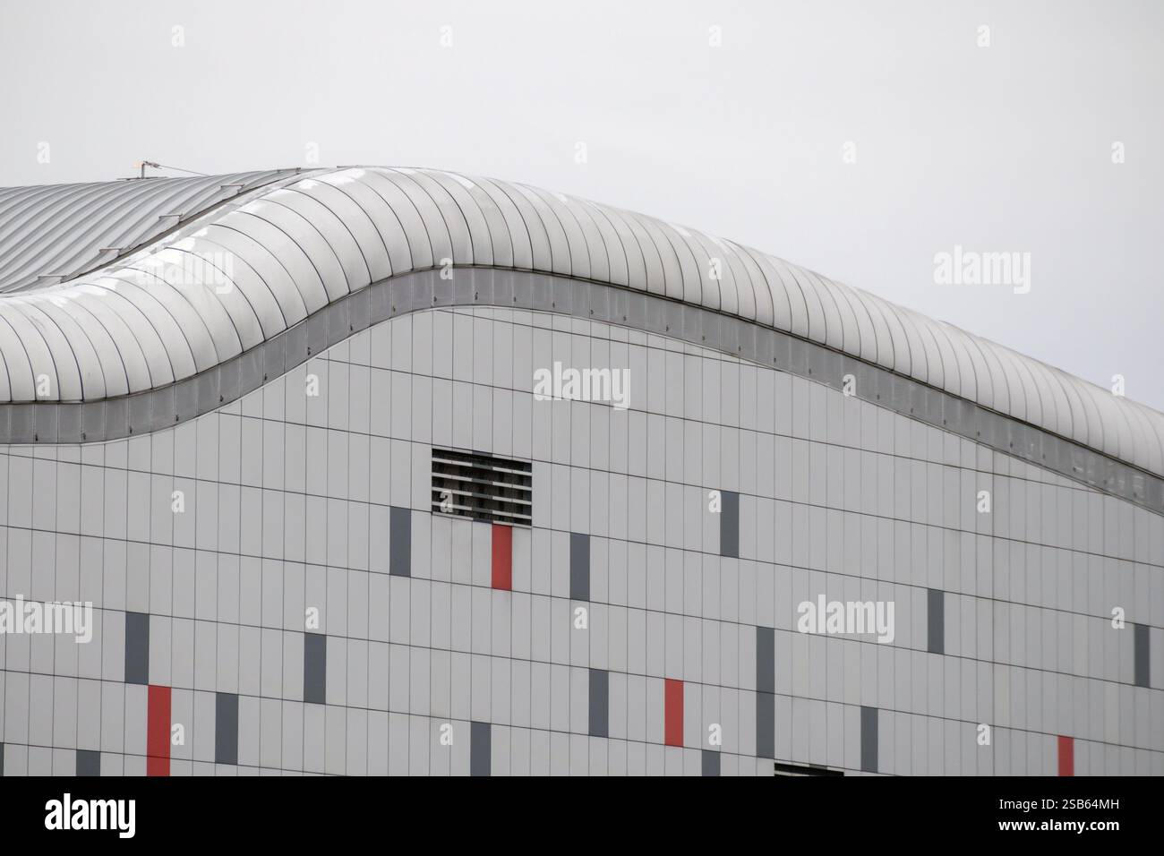 a large building with modern architecture. The building is made of ...