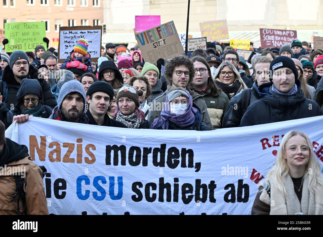Augsburg, Germany. 01st Feb, 2025. Demonstrators hold a banner reading ...