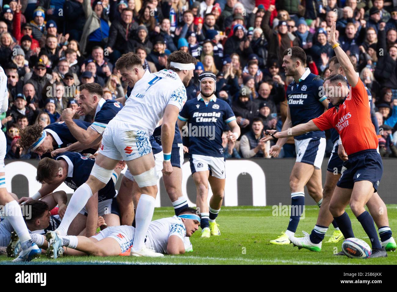 Referee points to award 7. Rory Darge (COCAPTAIN) a try for Scotland