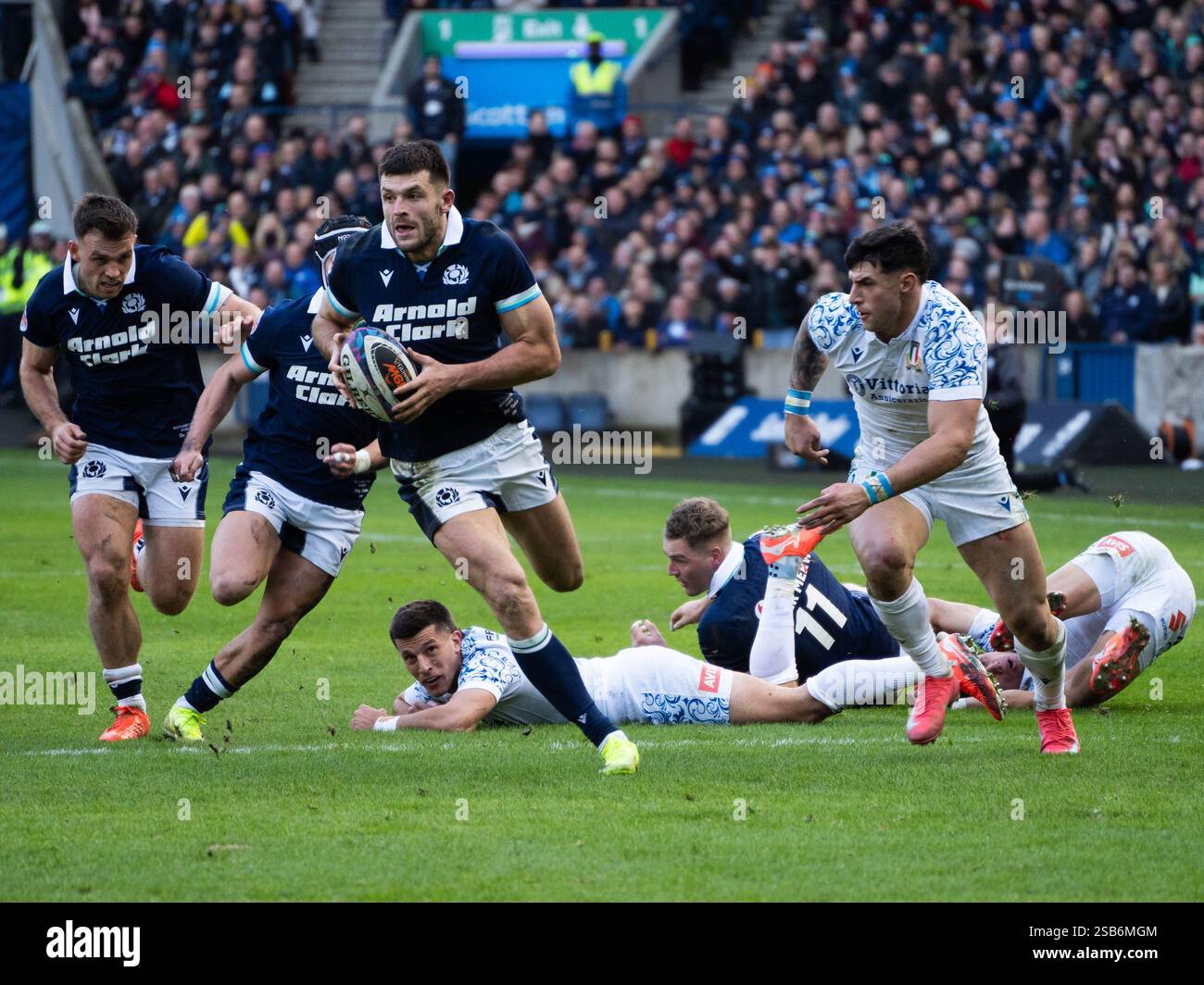 15. Blair Kinghorn is tackled in the Scotland vs Italy 6 Nations Rugby