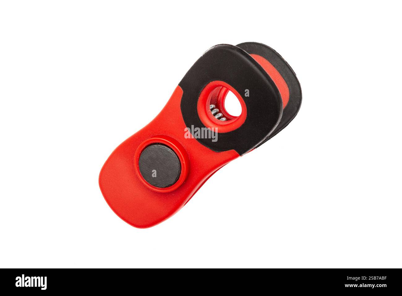 Red plastic clamp with magnet isolated on white Stock Photo