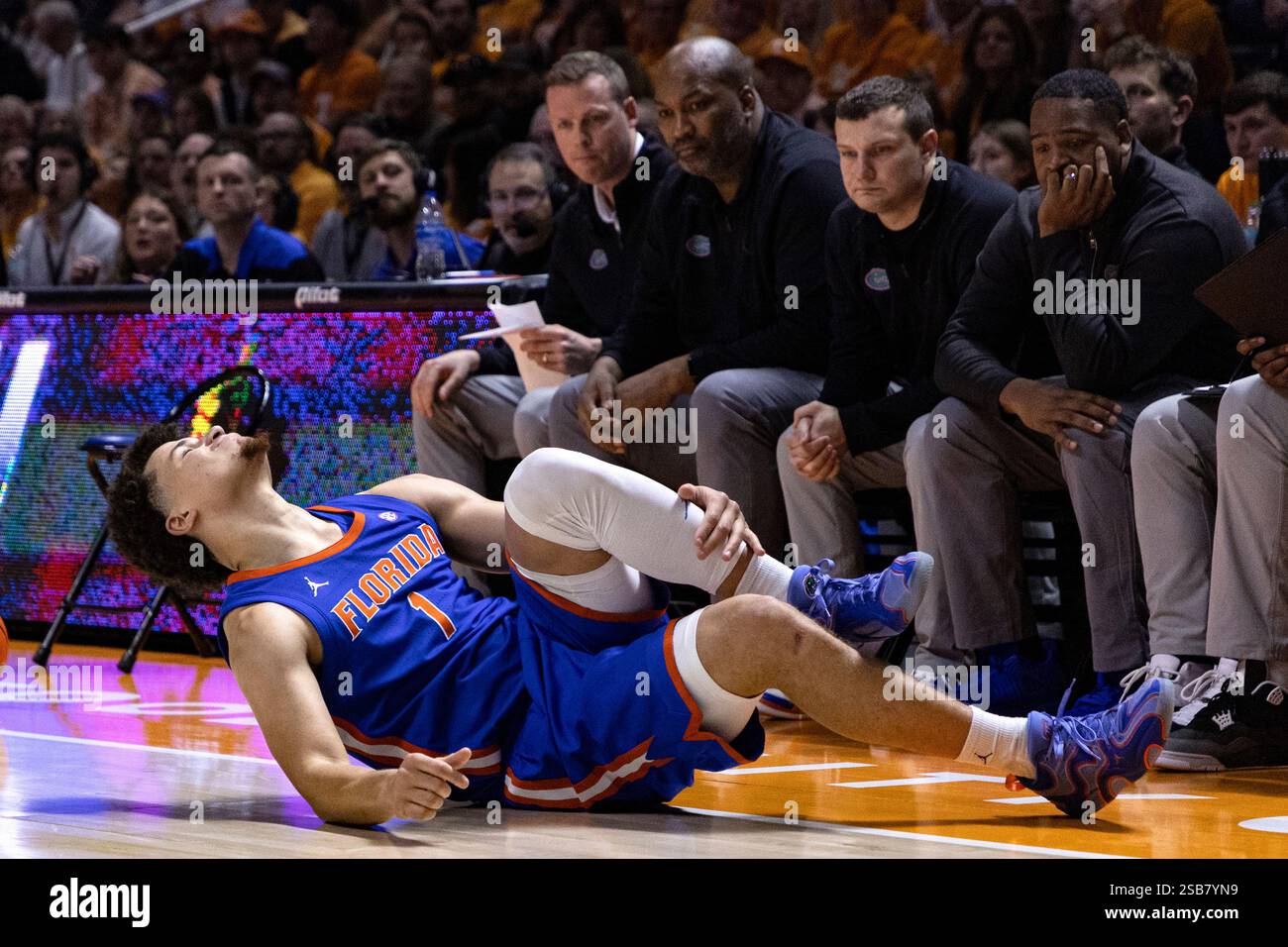 Florida guard Walter Clayton Jr. (1) grimaces as he falls to the floor