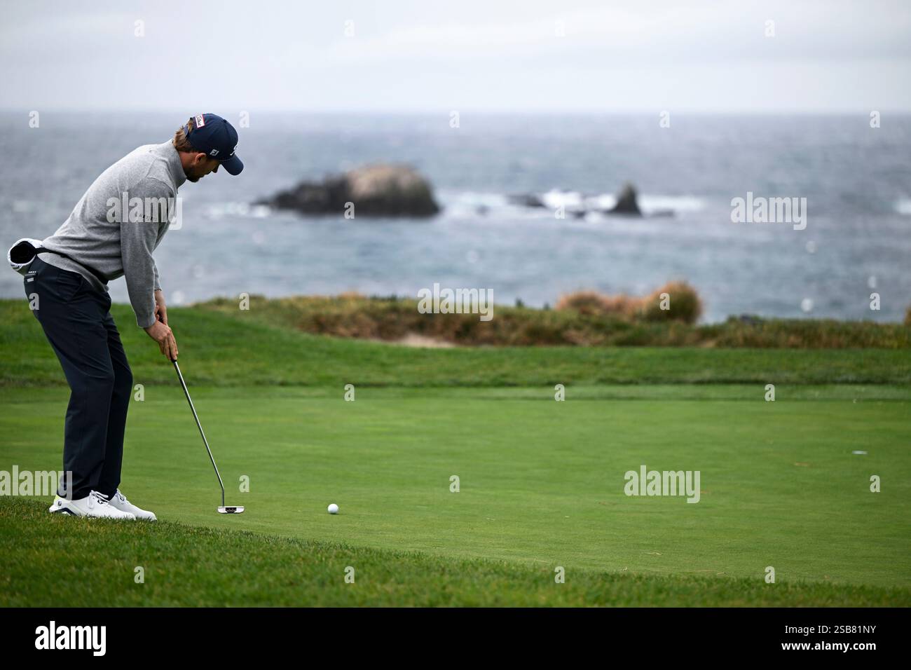 Russell Henley putts on the fourth green at Pebble Beach Golf Links