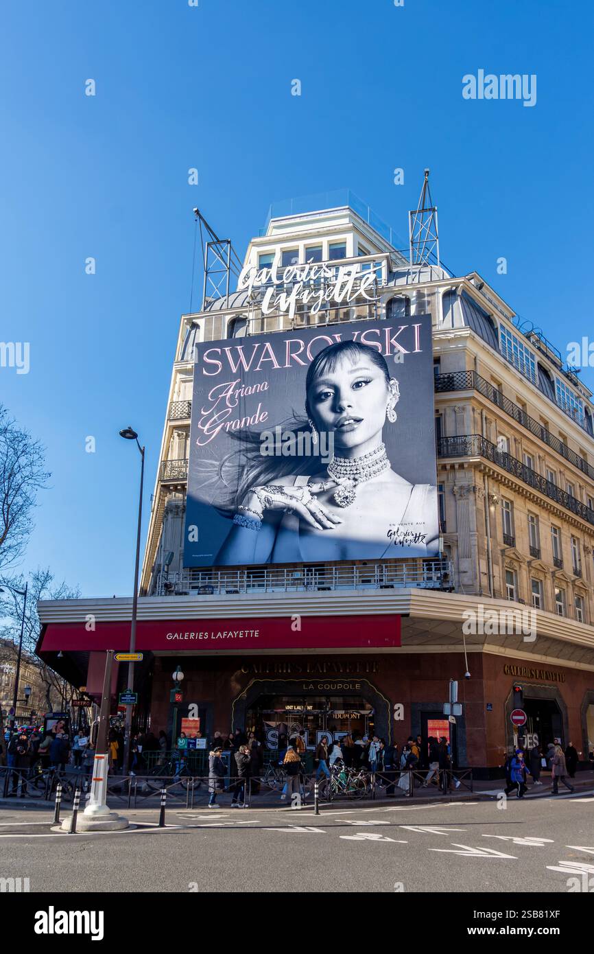 Billboard for Swarovski, an Austrian crystal glass and jewelry company, starring singer-actress Ariana Grande, on the facade of Galeries Lafayette Stock Photo