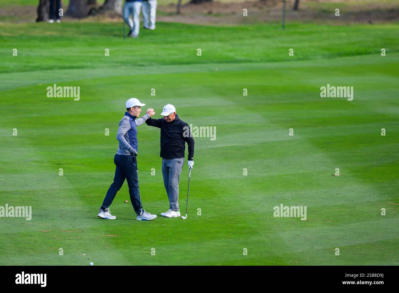 PEBBLE BEACH, CA - JANUARY 30: Jeff Rhodes highfives Jimmy Dunne during ...