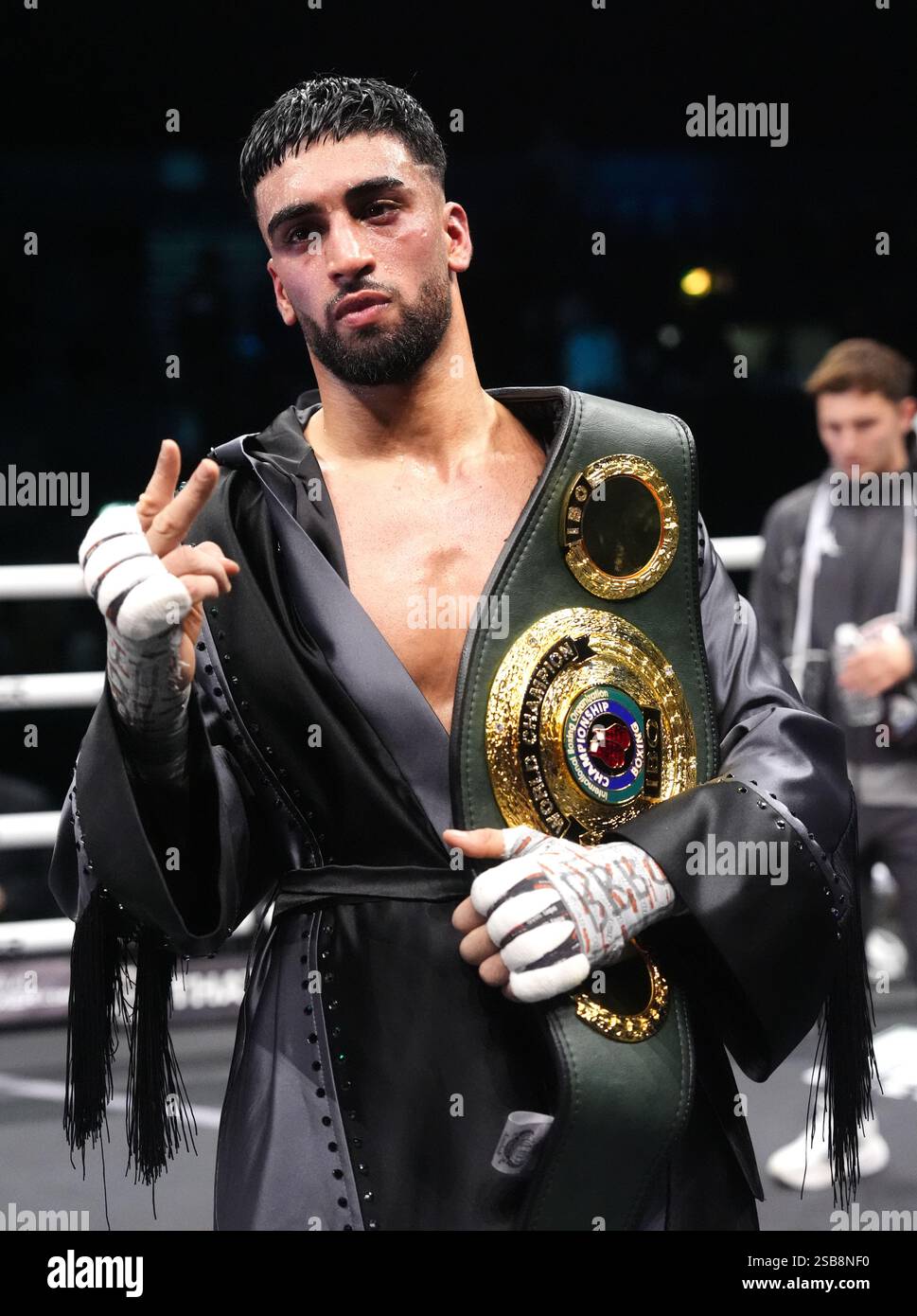 Adam Azim celebrates victory against Sergey Lipinets (not pictured ...