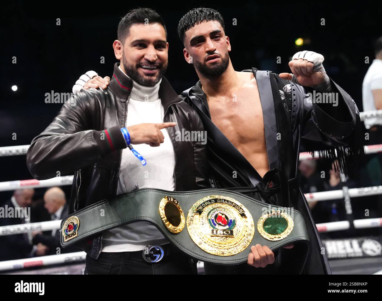 Adam Azim (right) celebrates victory against Sergey Lipinets (not ...