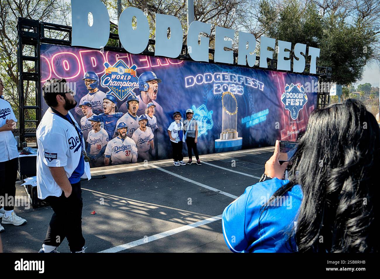 Los Angeles Dodgers baseball fans have a photo taken at DodgerFest at