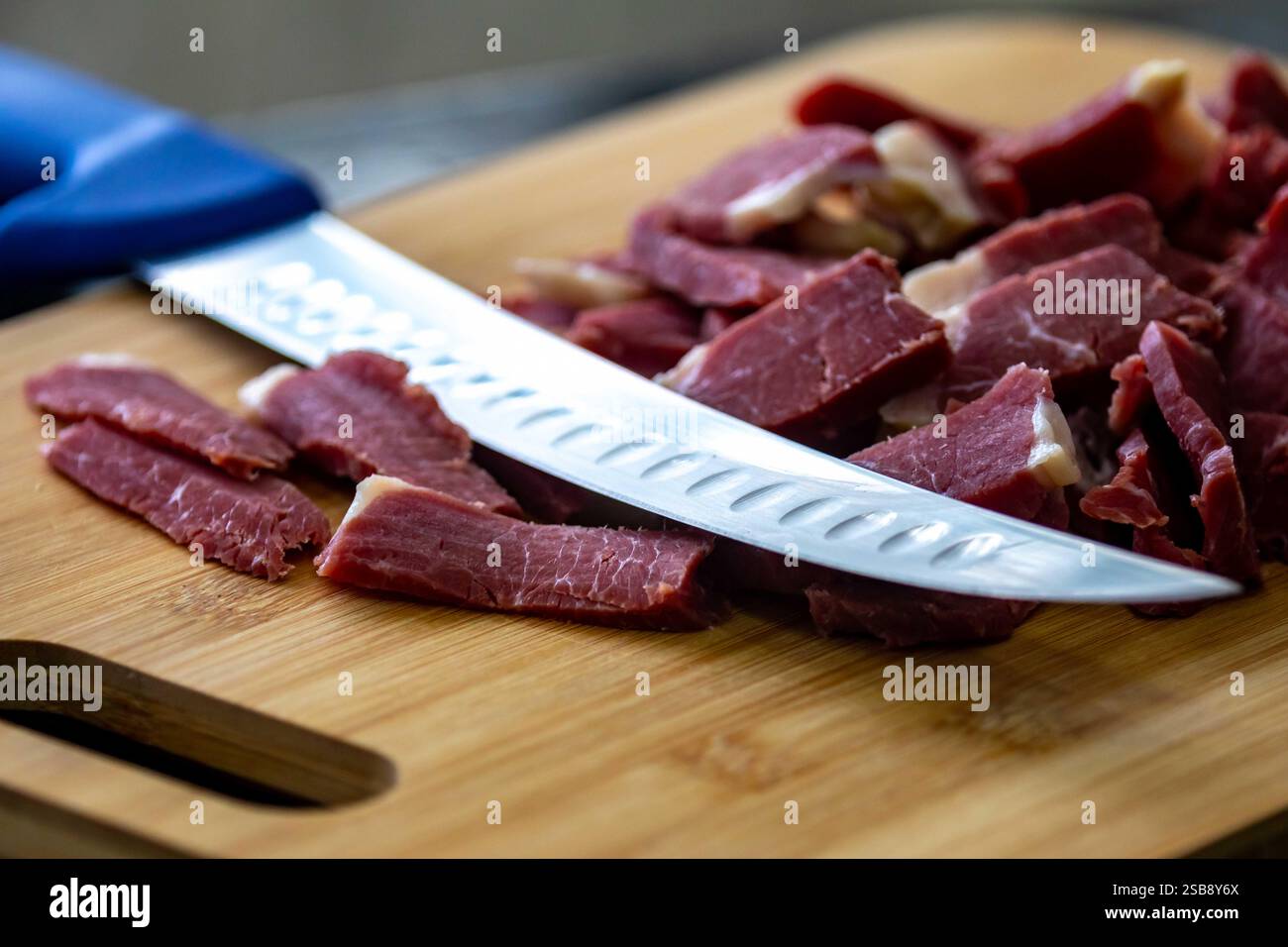Traditional rustic salted sun-dried meat Stock Photo - Alamy