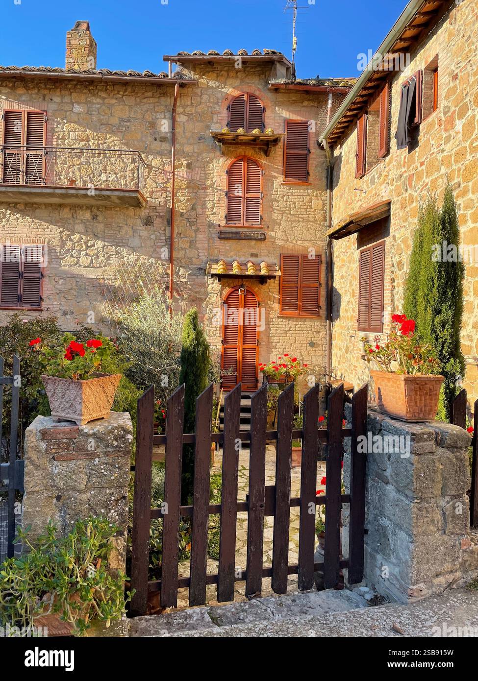 Charming traditional stone houses in the medieval village of Monticchiello, Italy - Smartphone Captured Stock Image