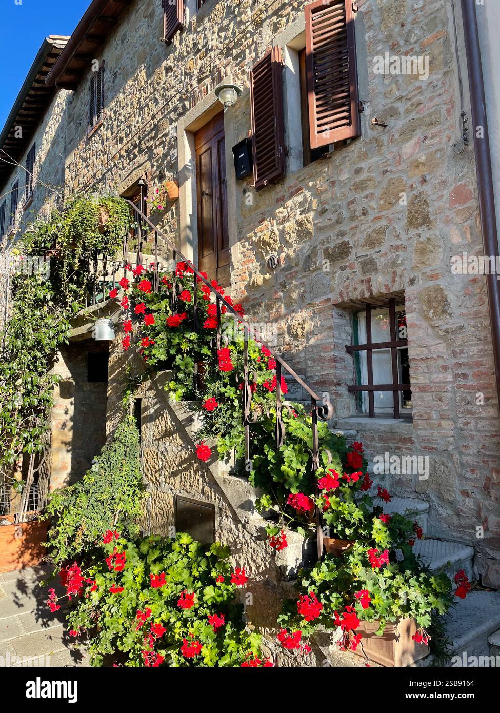 Charming old buildings in the picturesque medieval village of Monticchiello, Italy - Smartphone Captured Stock Image