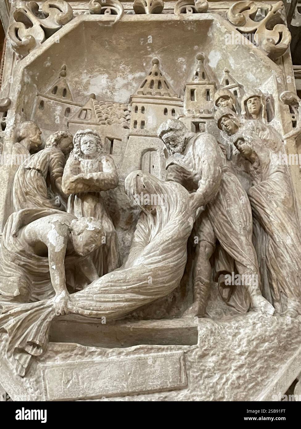 Nardò, Italy. Interior of Basilica cattedrale di Santa Maria Assunta/ Nardò Cathedral. Relief depicting the burial of Jesus Christ. - Smartphone Captured Stock Image
