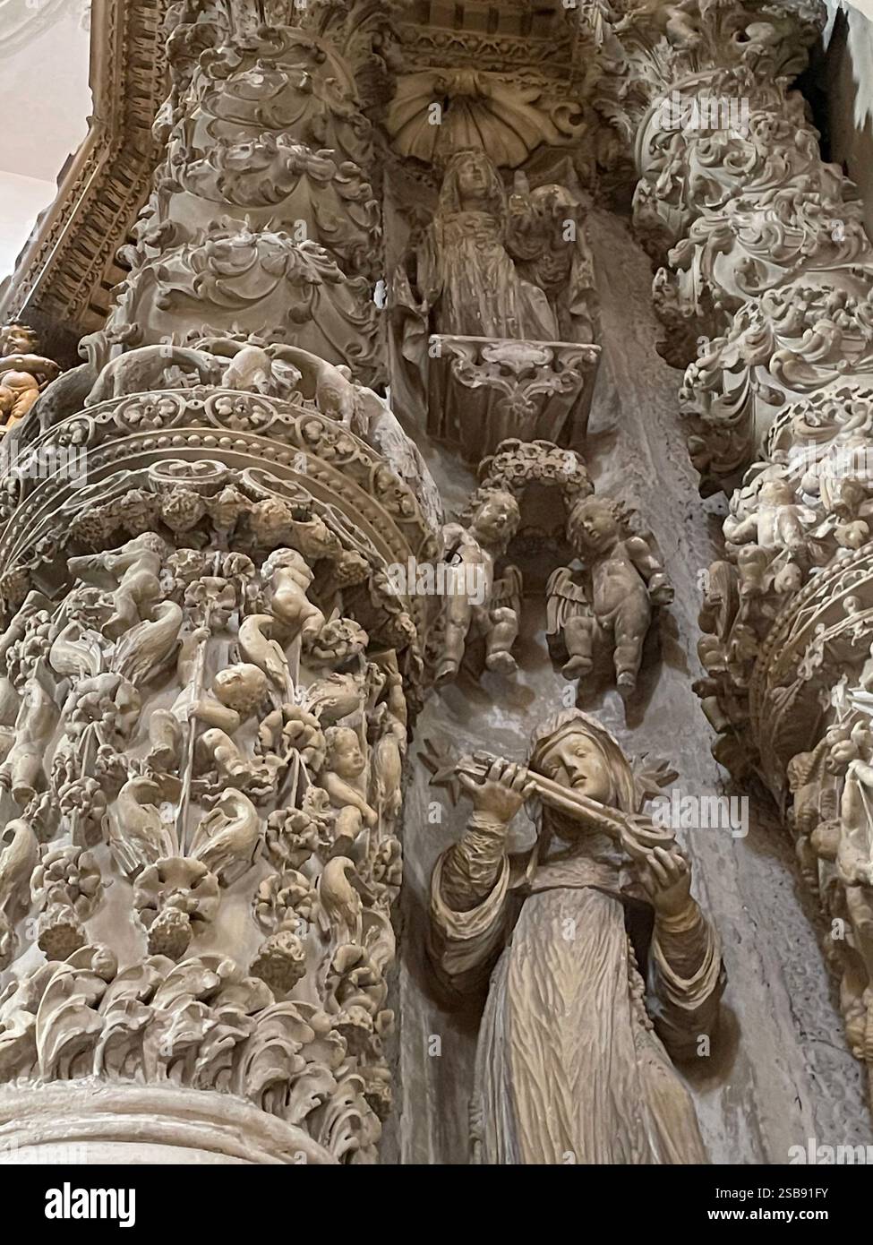 Nardò, Italy. Interior of Basilica cattedrale di Santa Maria Assunta/ Nardò Cathedral. Details on twisted columns in an altar. - Smartphone Captured Stock Image