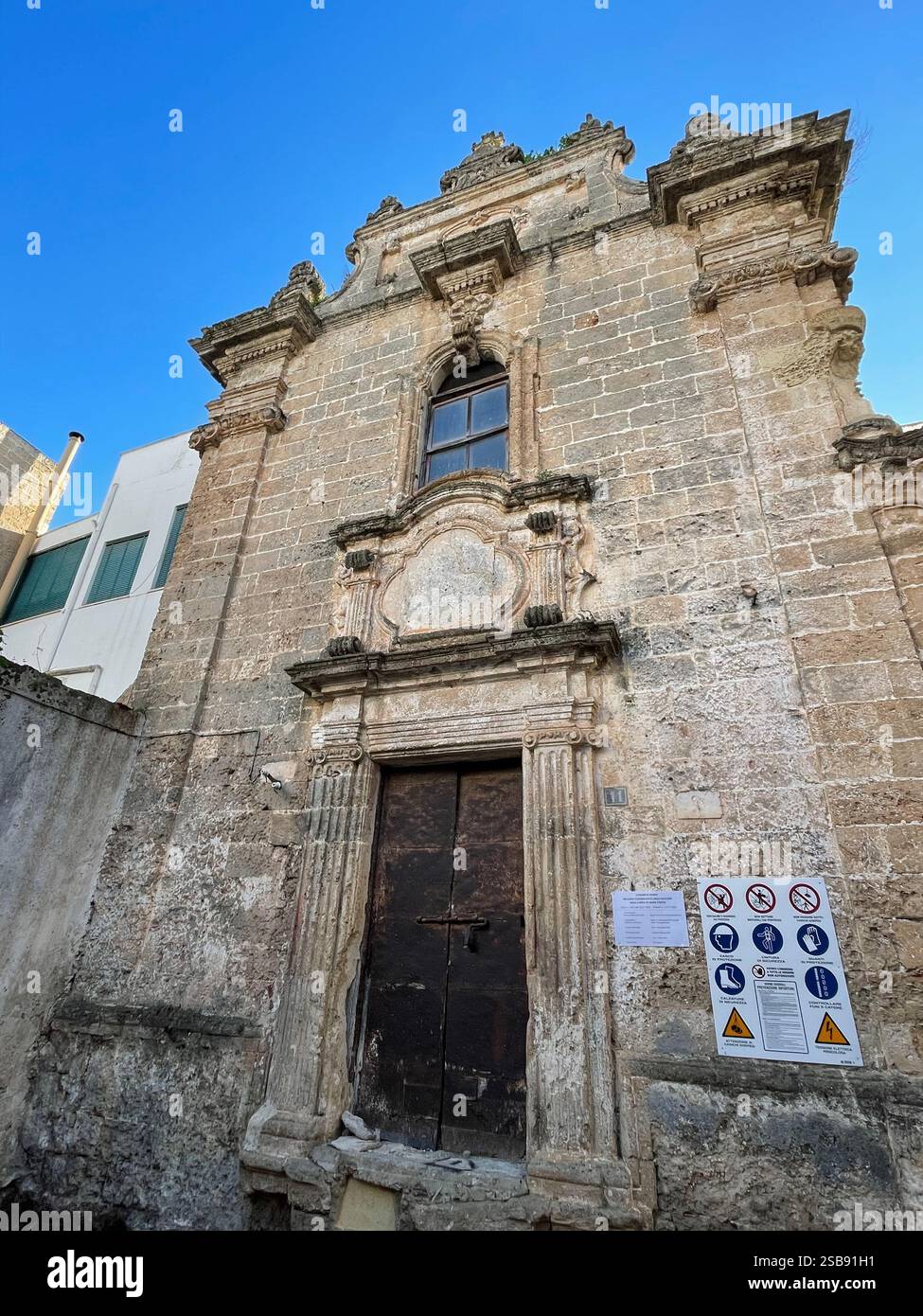 Nardò, Italy. Exterior view of the 18th century Church of St. Mary of Constantinople, formerly of the Holy Cross. Old portal. - Smartphone Captured Stock Image