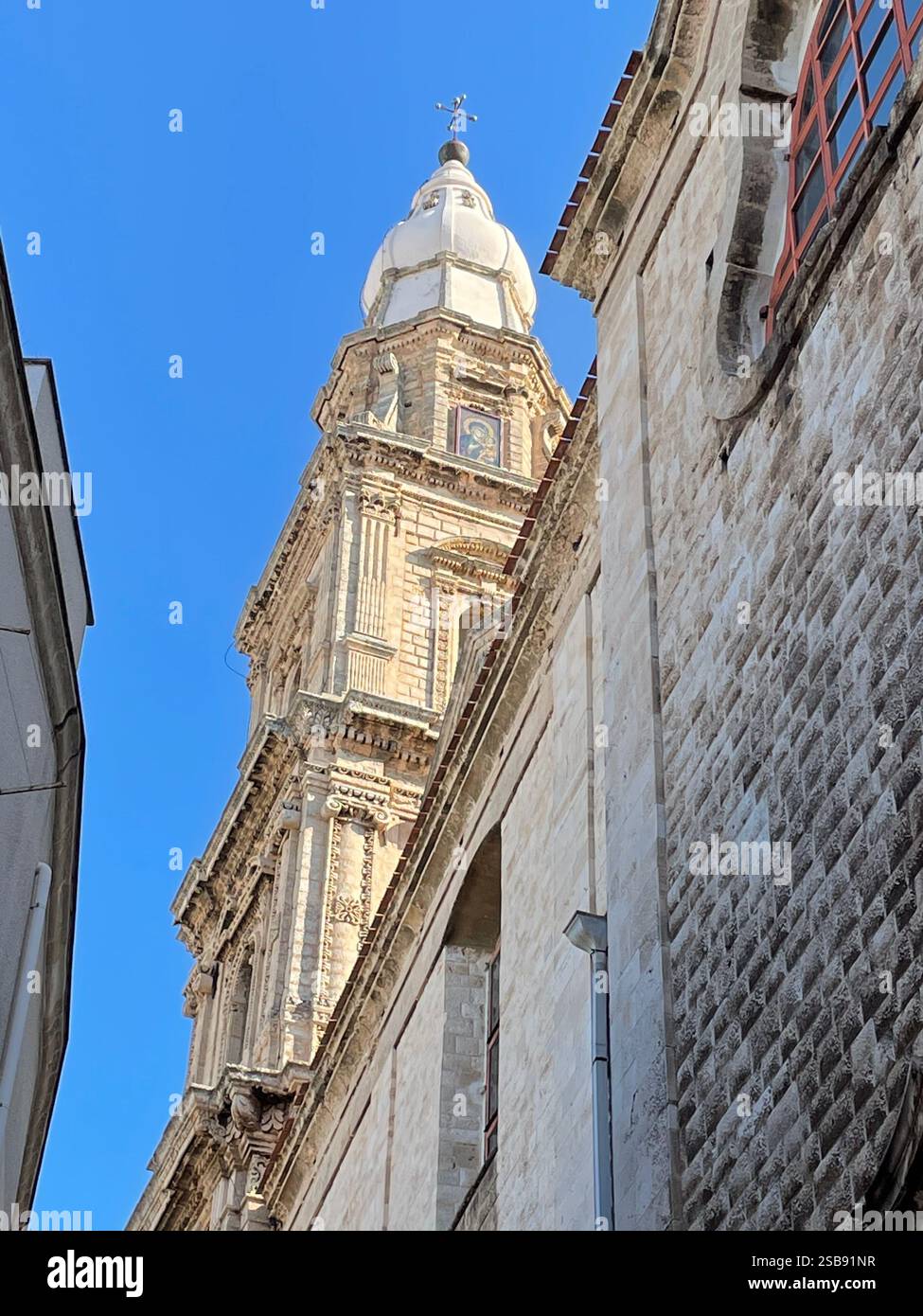 Monopoli, Italy. The bell tower of the medieval Roman Catholic Cathedral. - Smartphone Captured Stock Image