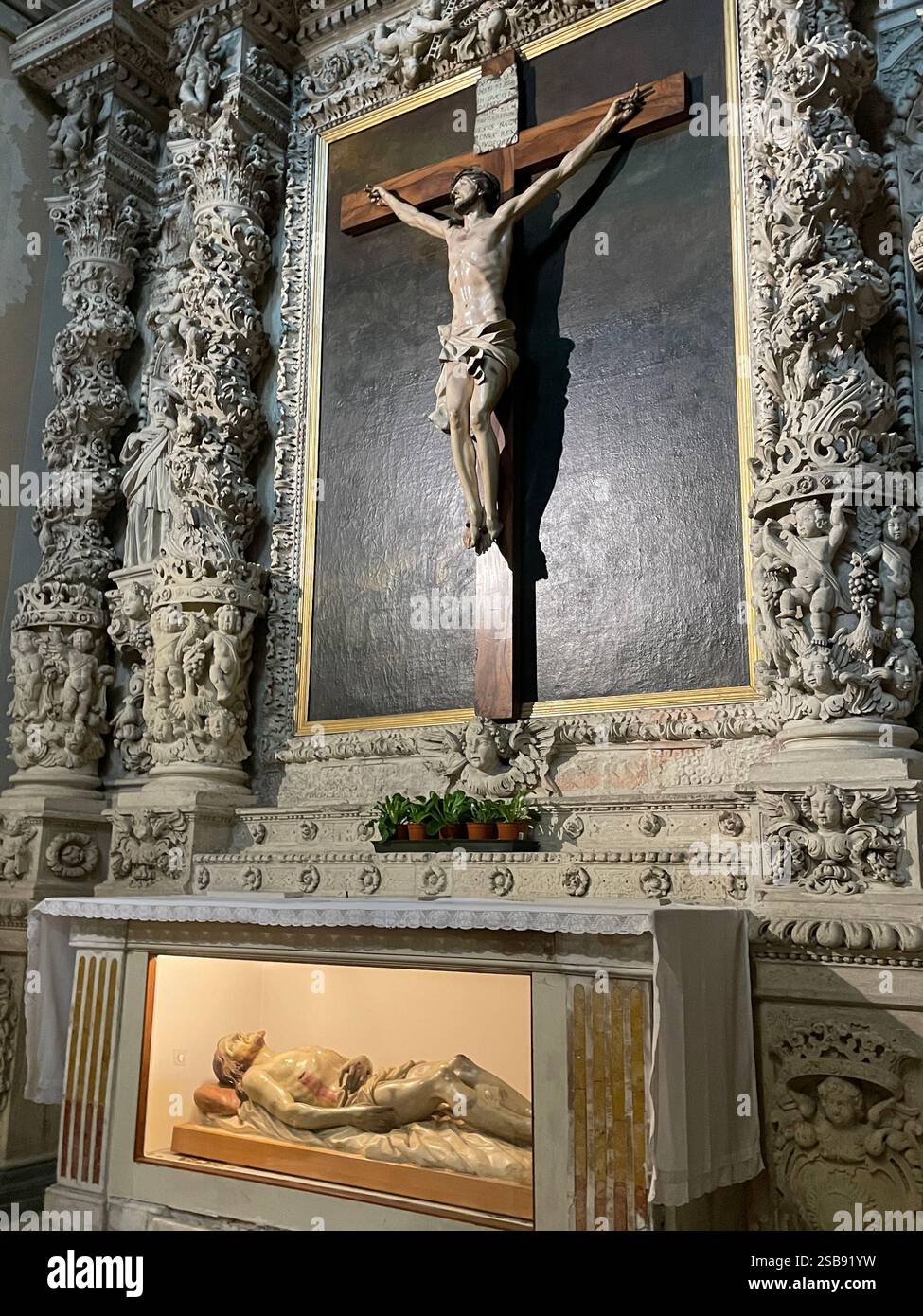 Molfetta, Italy. Altar of the Crucifix inside the Molfetta Cathedral. - Smartphone Captured Stock Image