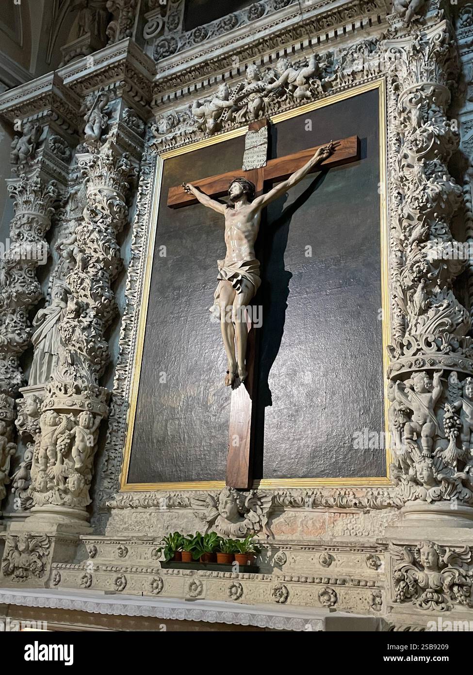 Molfetta, Italy. Altar of the Crucifix inside the Molfetta Cathedral. - Smartphone Captured Stock Image