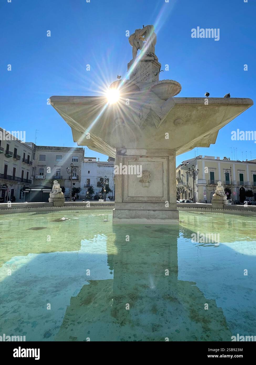 Mola di Bari, Italy. View of Piazza XX Settembre, with the fountain-monument in the center. - Smartphone Captured Stock Image