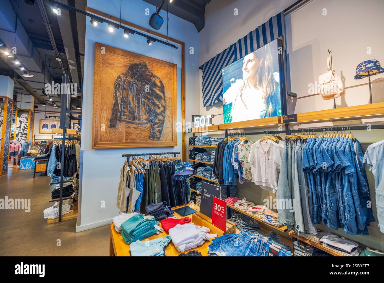 Levi’s store interior featuring denim apparel display with 501 branding ...
