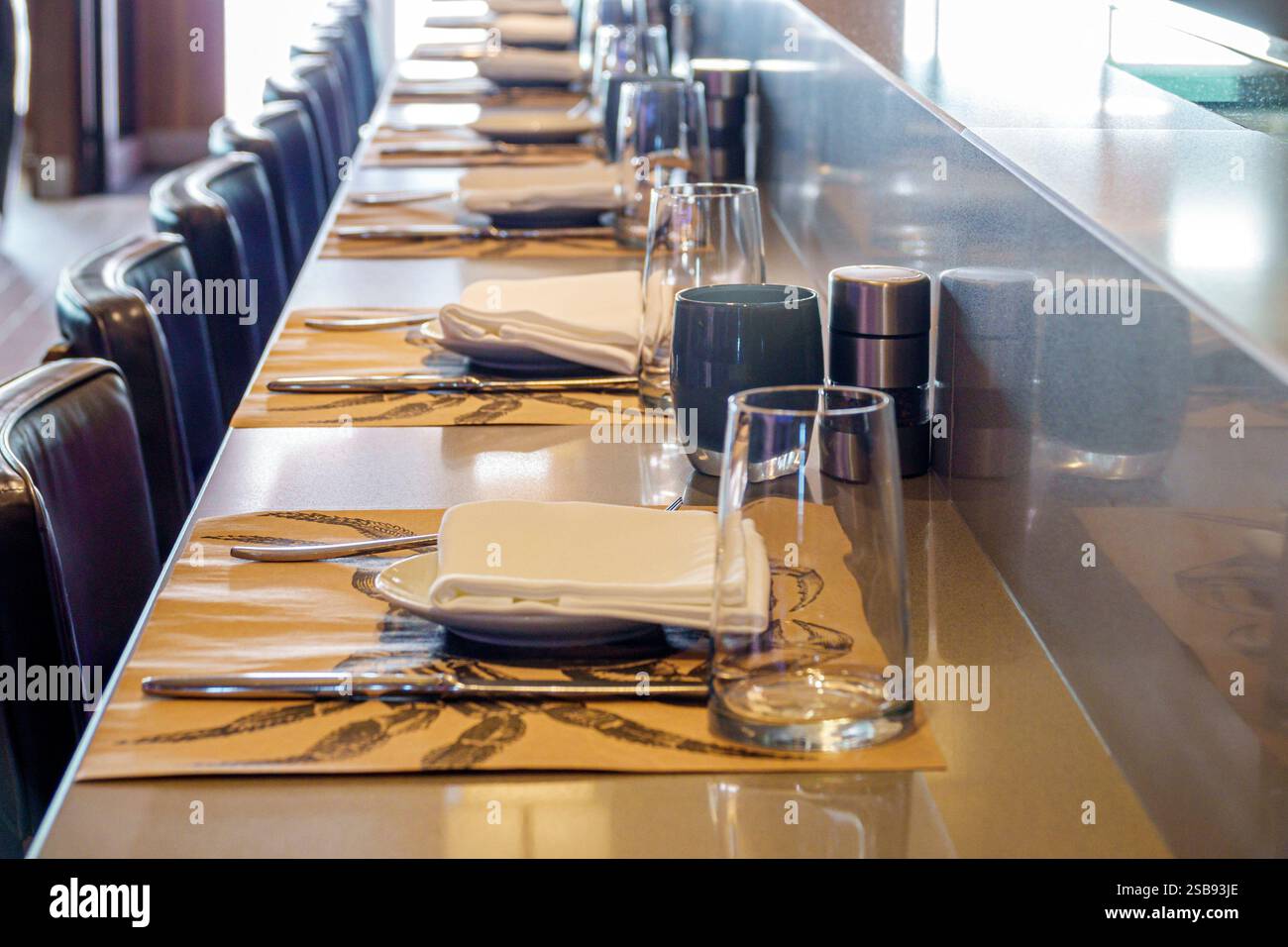 Miami Florida,Norwegian Cruise Line NCL Breakaway ship,11-day Caribbean Sea itinerary,onboard inside interior,modern dining setup,restaurant tableware Stock Photo