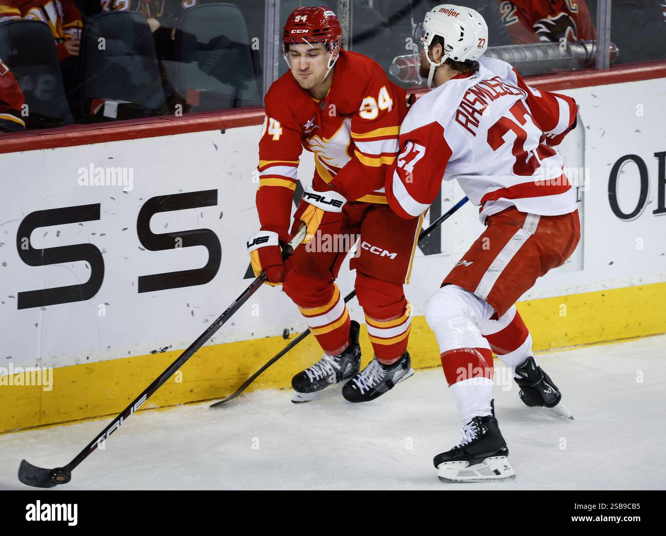 Detroit Red Wings' Michael Rasmussen, right, checks Calgary Flames ...