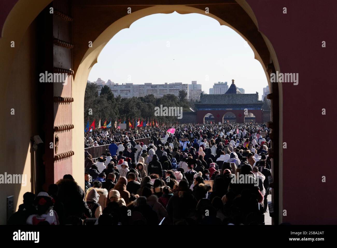 People wait in line to enter the Temple of Heaven complex during a week