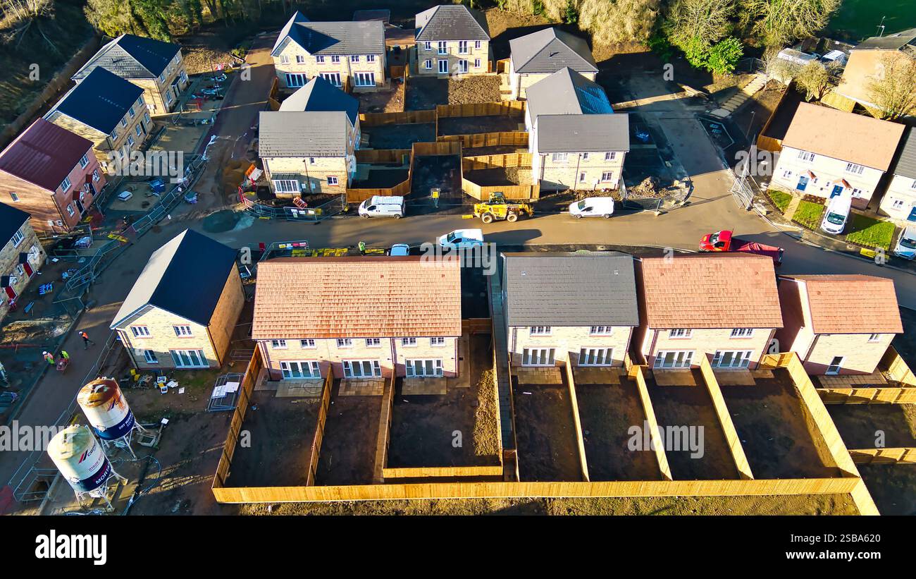 Aerial view of a new housing development. Rows of two-story houses ...