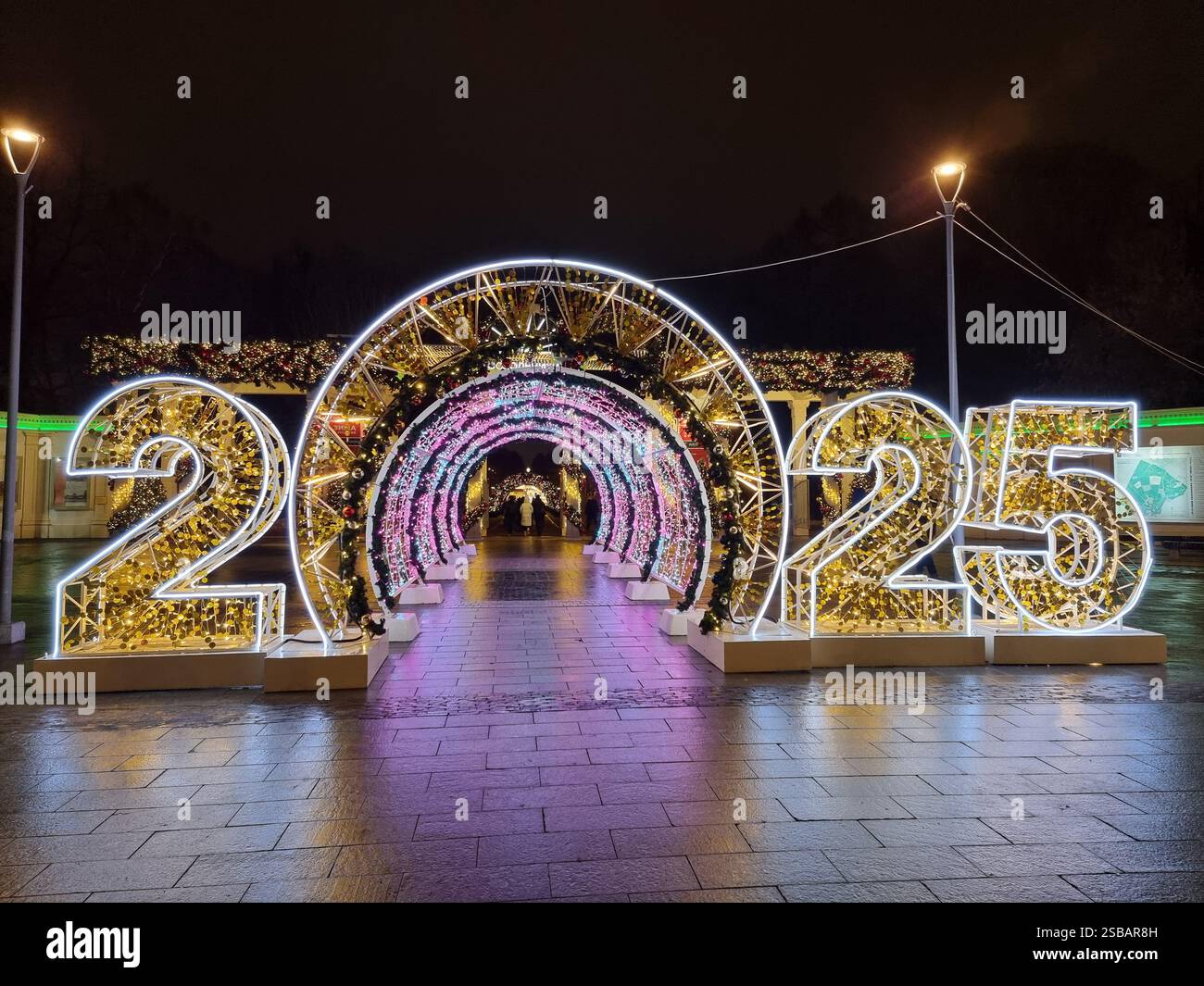 Light tunnel with numbers 2025; coloured lights; New Year; Christmas decorations - Smartphone Captured Stock Image