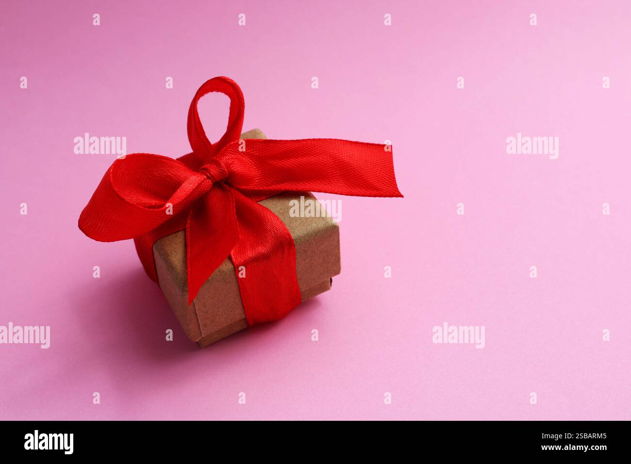 Beautiful gift box with red bow Stock Photo