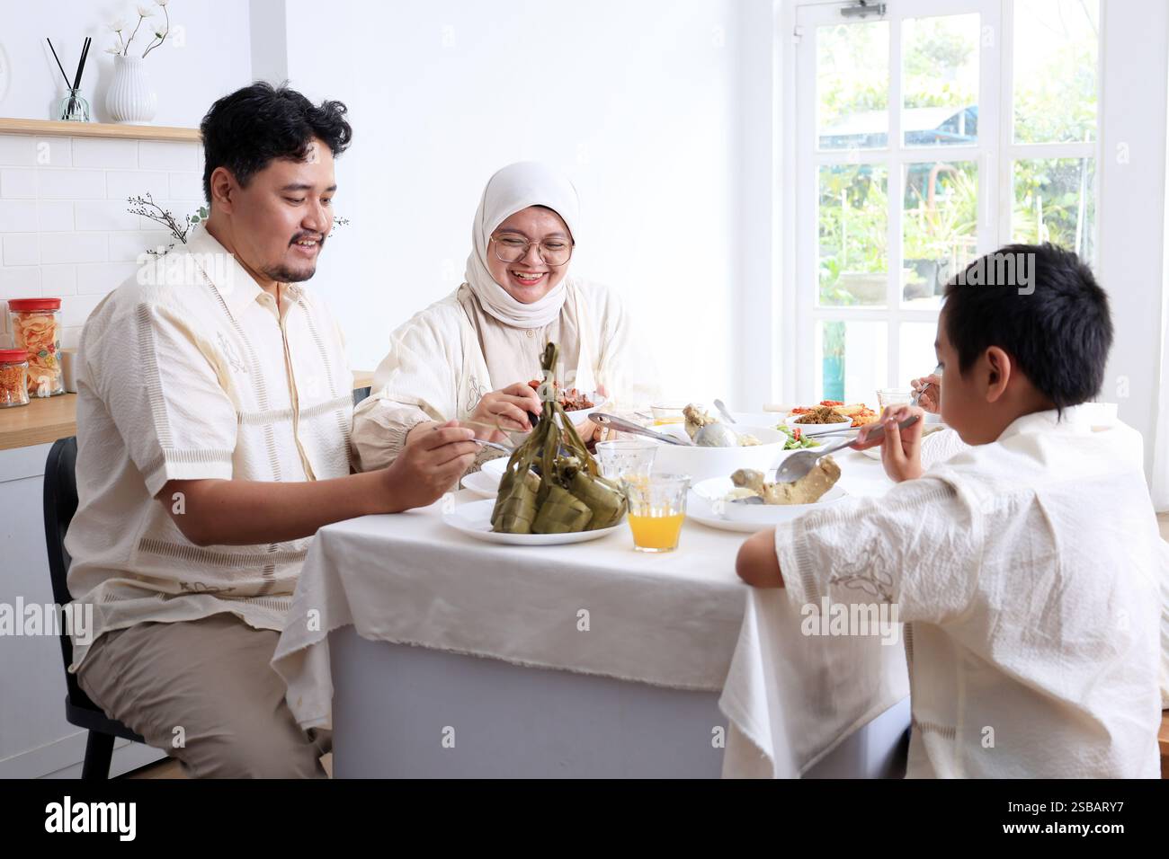 Young attractive family two kids hi-res stock photography and images ...