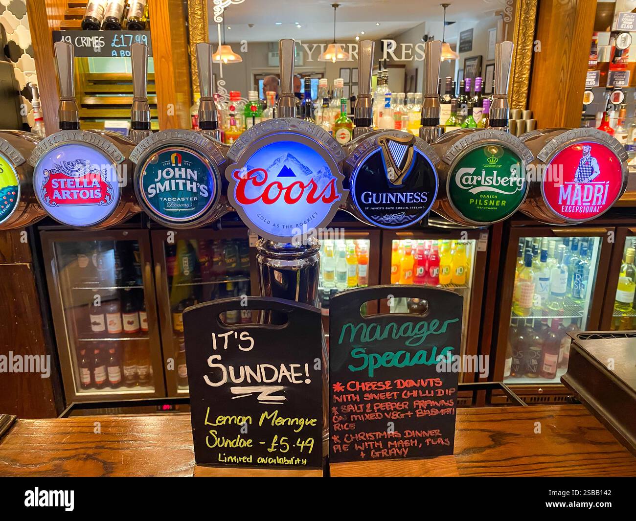 Chalk boards on a bar at a gastro-pub advertise manager's specials which are not on the normal menu. - Smartphone Captured Stock Image
