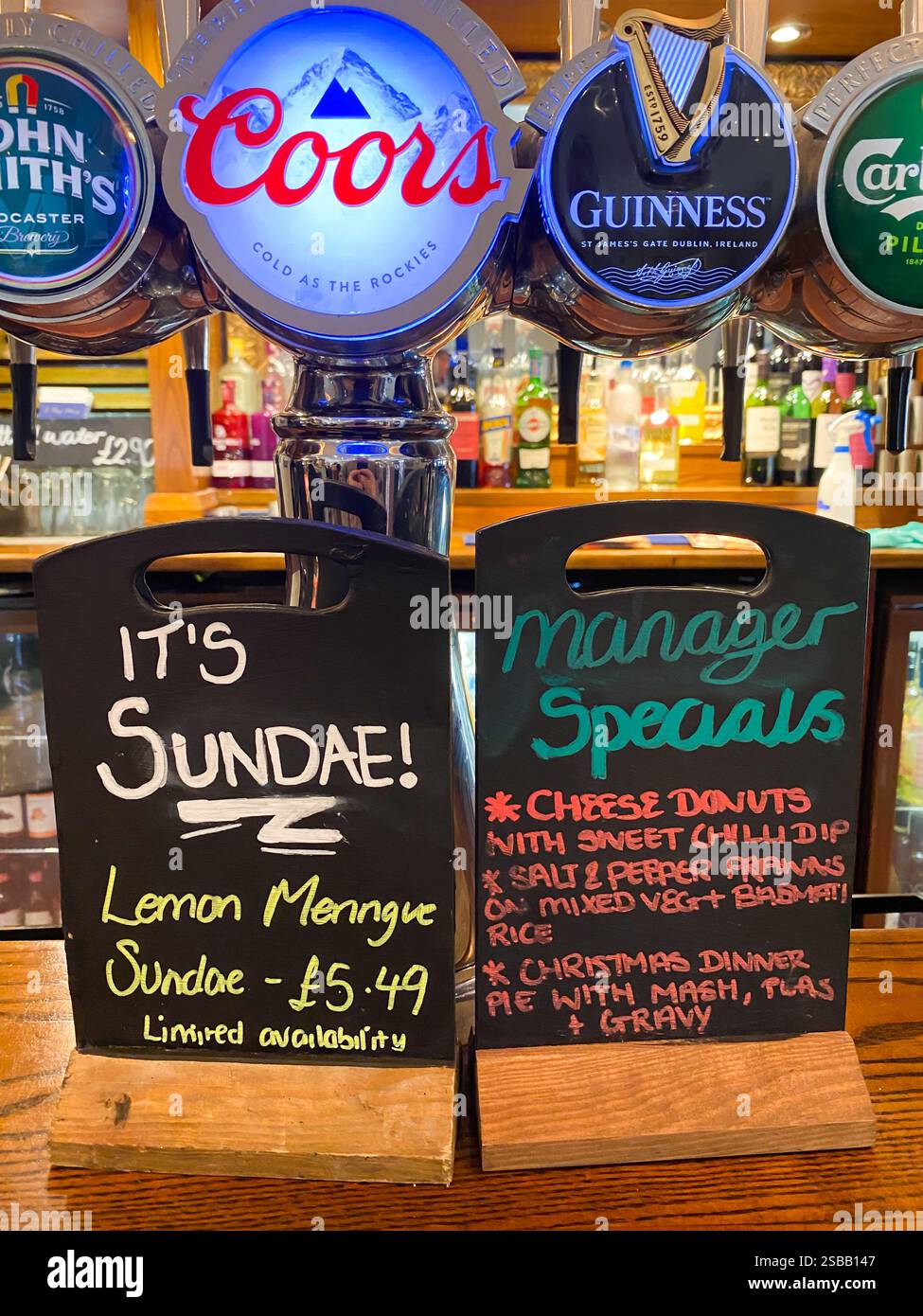 Chalk boards on a bar at a gastro-pub advertise manager's specials which are not on the normal menu. - Smartphone Captured Stock Image