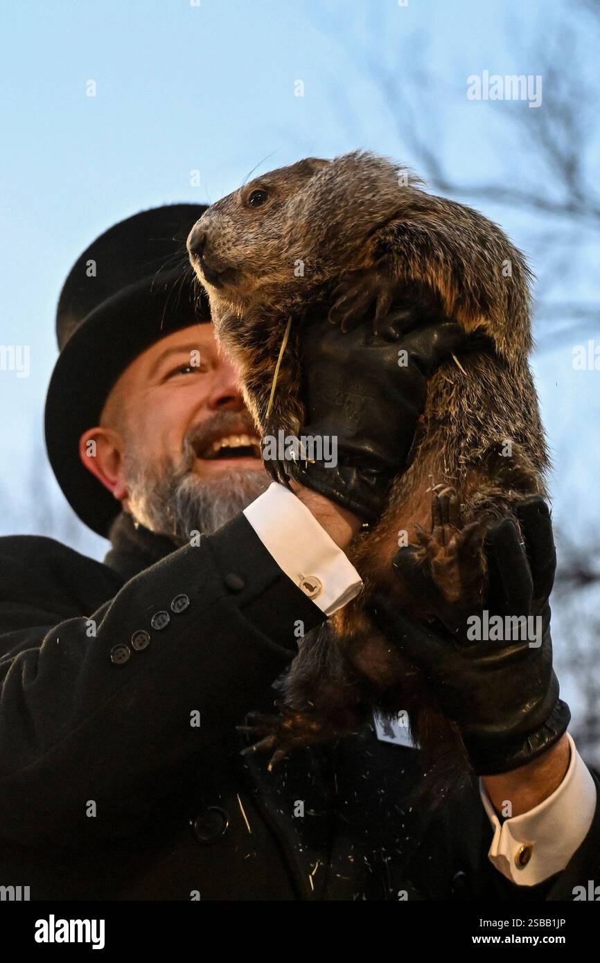 Groundhog Club handler A.J. Dereume holds Punxsutawney Phil, the