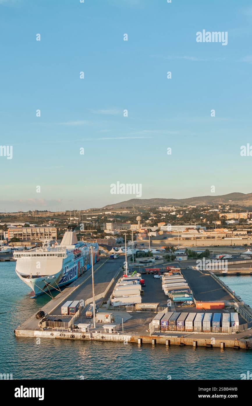Civitavecchia, Italy - February 2, 2025: A commercial ferry docked in the port, and maritime trade logistics infrastructure. Concept: commercial marit Stock Photo