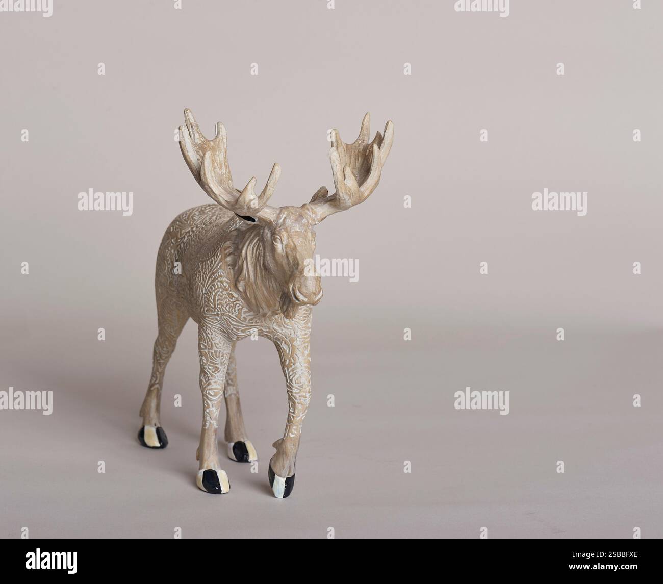 figurine of moose with large rack of antlers Stock Photo - Alamy