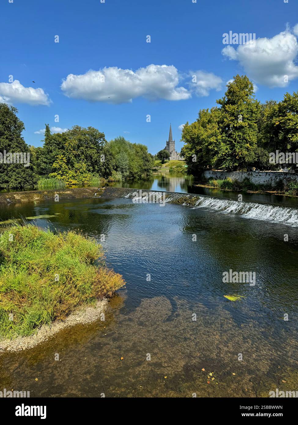 The river Cahir in Tipperary, Ireland with St Paul's Church of Ireland in the background. - Smartphone Captured Stock Image