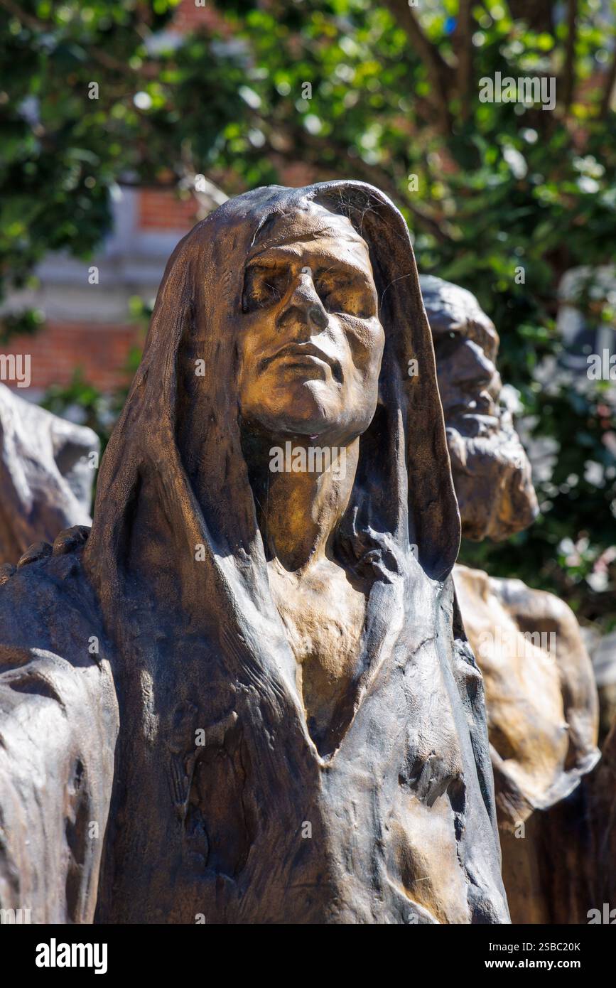 Blind person being led by a child in a bronze statue by Guillaume Charlier, Tournai, Belgium Stock Photo